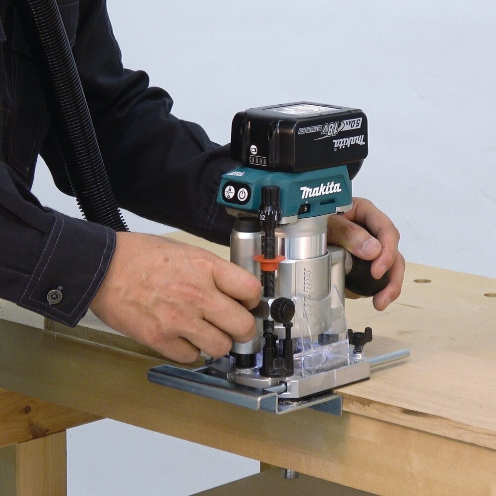 Akumuliatorinė freza Makita DRT50Z, 6/8 m + Šoninis ribotuvas 1 Akumuliatorinė freza Makita DRT50Z, 6/8 m + Šoninis ribotuvas 1